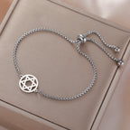 Pulsera ajustable con la <span data-glossary-id="etoile-de-david">estrella de David</span> símbolo judío plata
