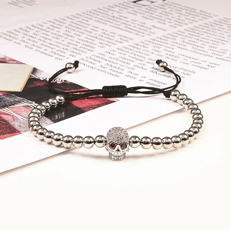 Beaded cord bracelet with mystical rhinestone skull in silver
