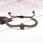 Beaded cord bracelet with mystical rhinestone skull in black