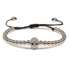 Beaded cord bracelet with mystical rhinestone skull in silver