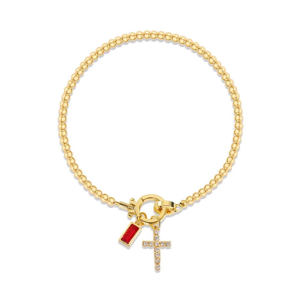 Pulsera con cruz y piedra de nacimiento