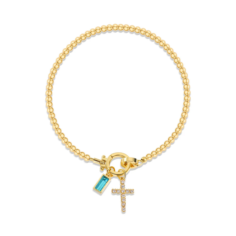 Pulsera con cruz y piedra de nacimiento