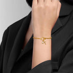 Pulsera con cruz y piedra de nacimiento