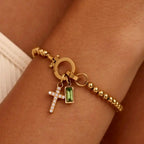 Pulsera con cruz y piedra de nacimiento de diciembre