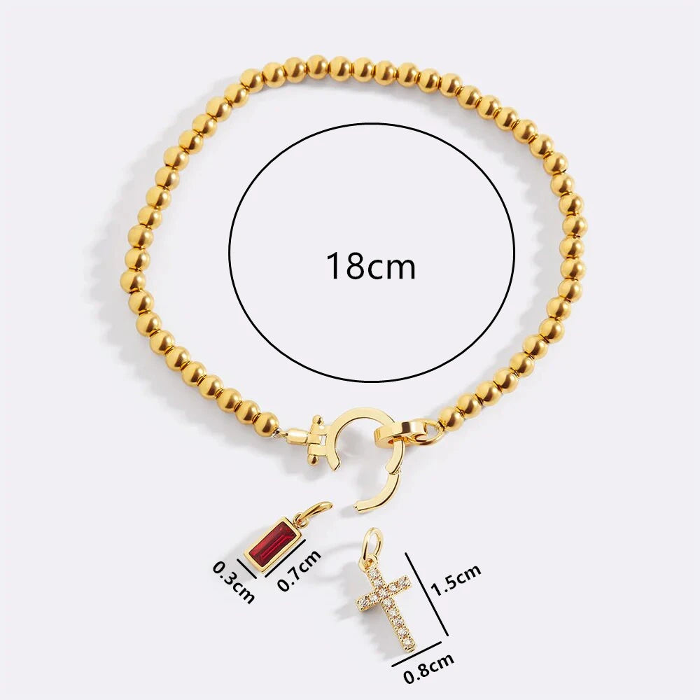 Pulsera con cruz y piedra de nacimiento