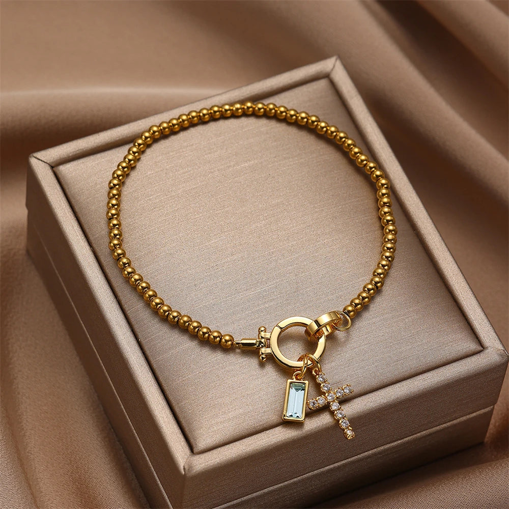 Pulsera con cruz y piedra de nacimiento