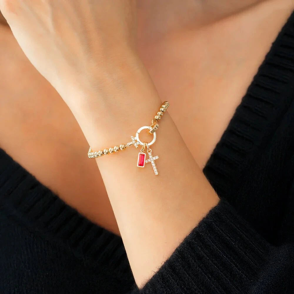 Pulsera con cruz y piedra de nacimiento