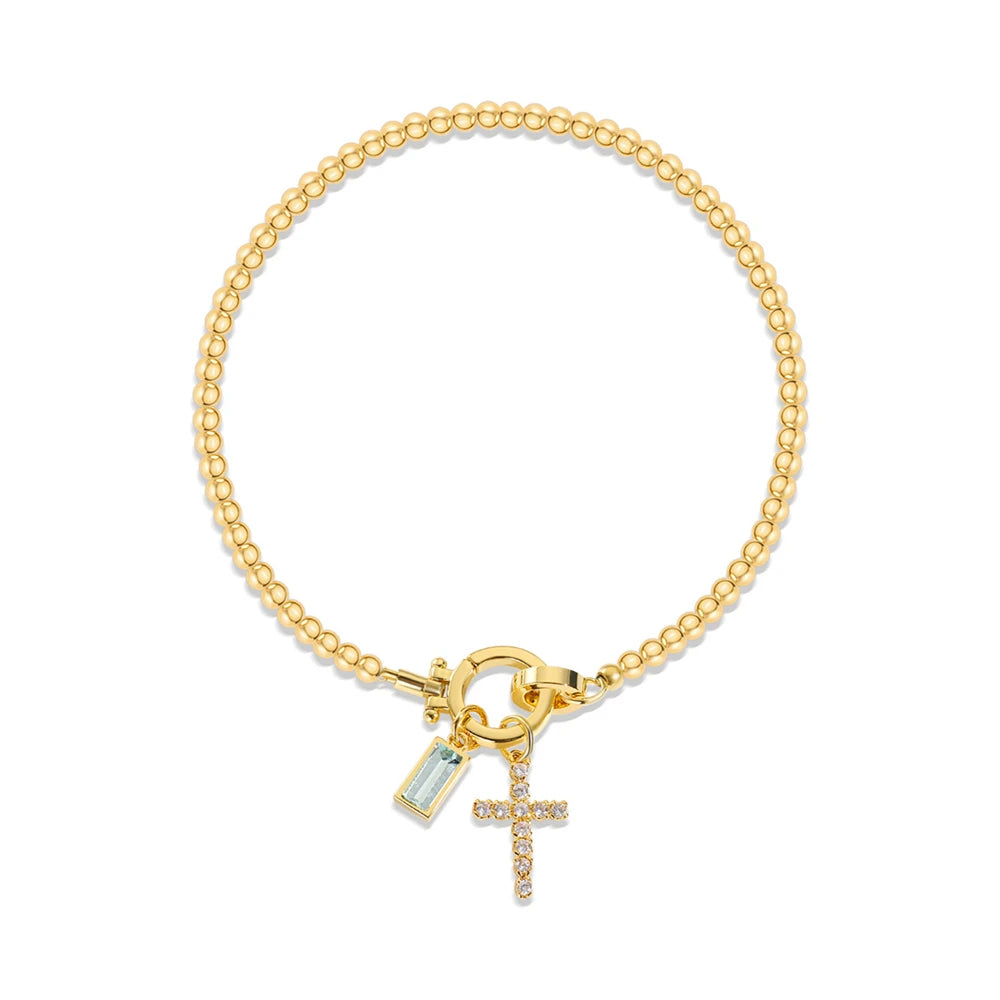 Pulsera con cruz y piedra de nacimiento