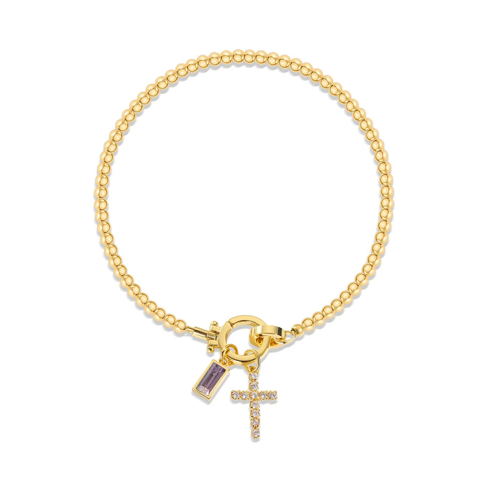 Pulsera con cruz y piedra de nacimiento