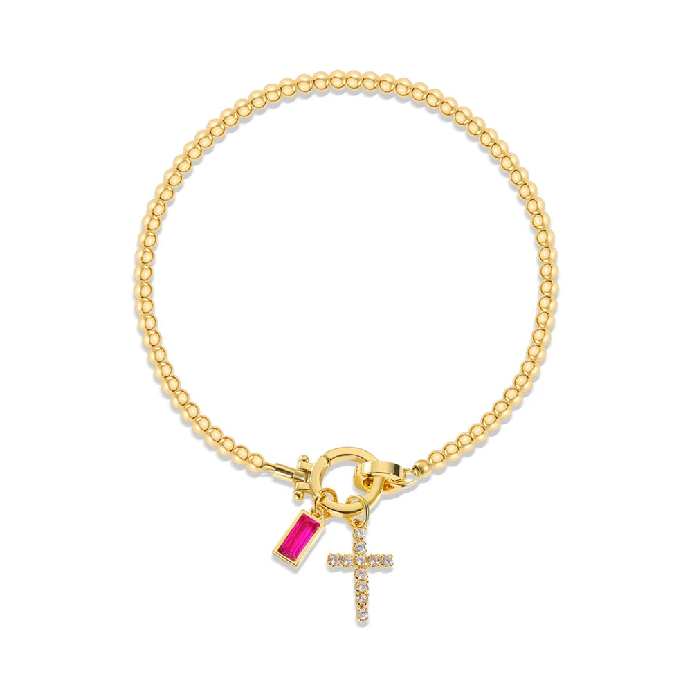 Pulsera con cruz y piedra de nacimiento