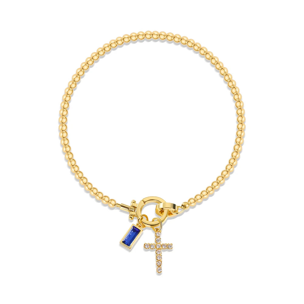 Pulsera con cruz y piedra de nacimiento