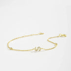 Pulsera con inicial de strass dorado 