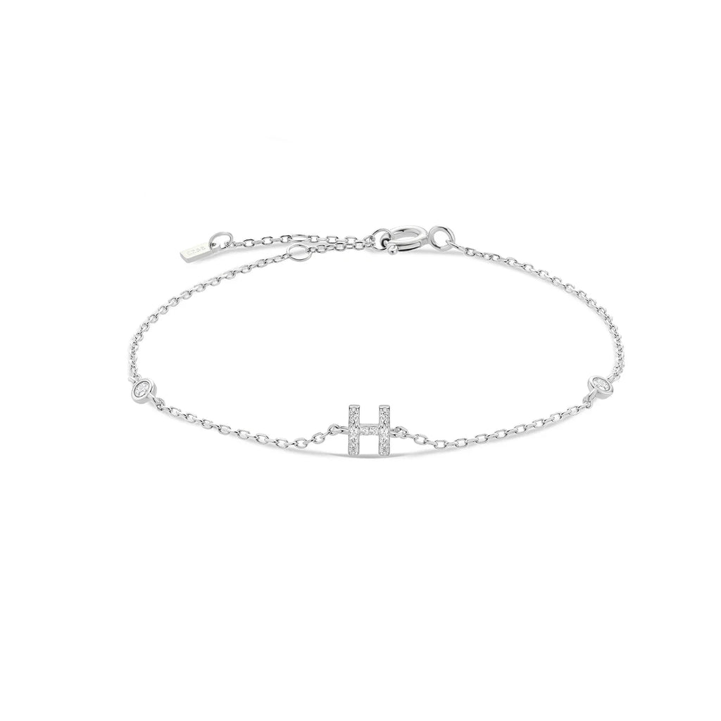 Pulsera con inicial de strass plateado h