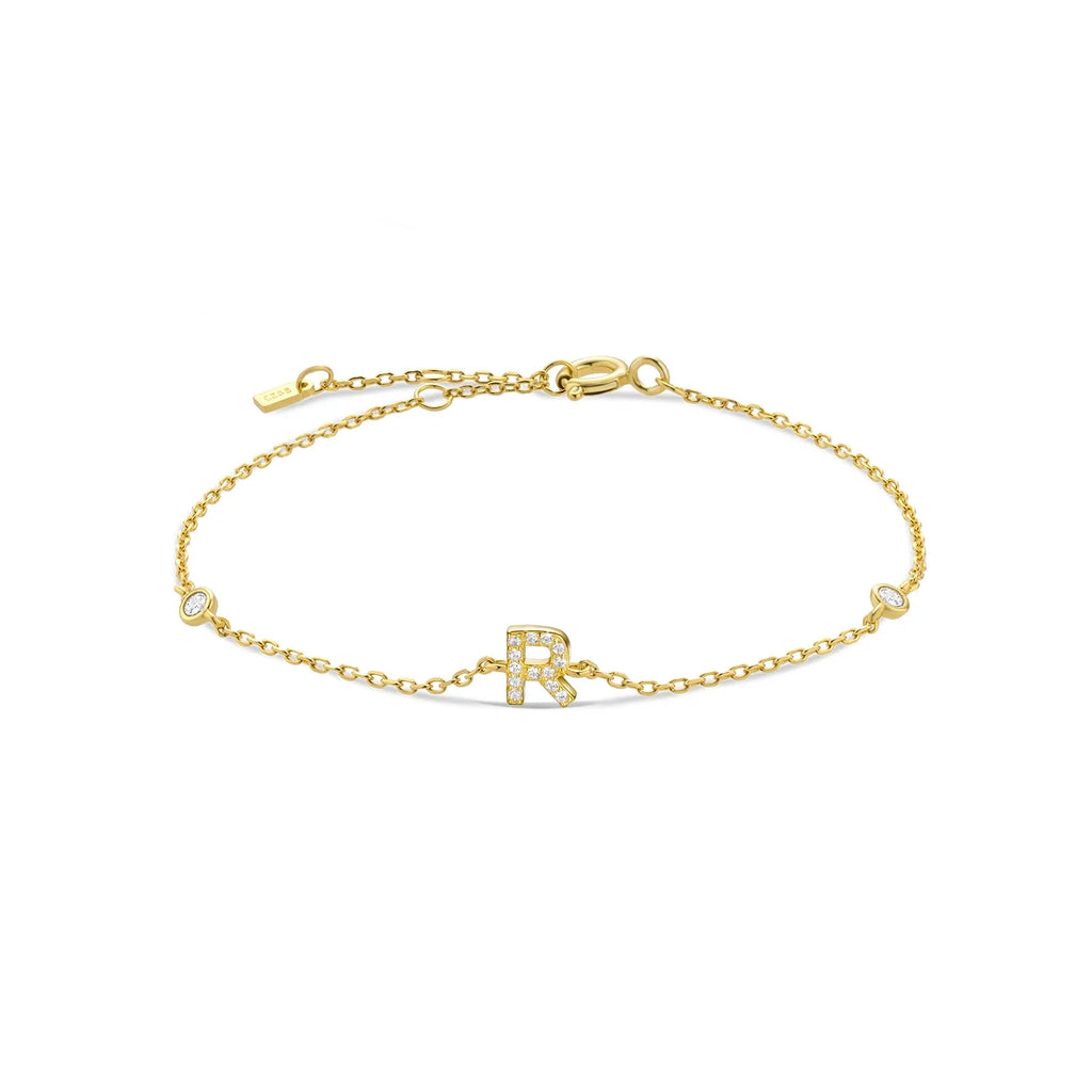 Pulsera con inicial de strass dorado r
