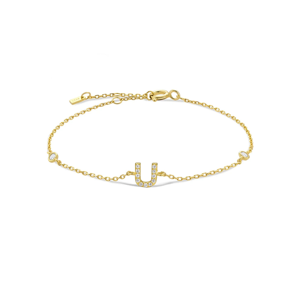 Pulsera con inicial de strass dorado u