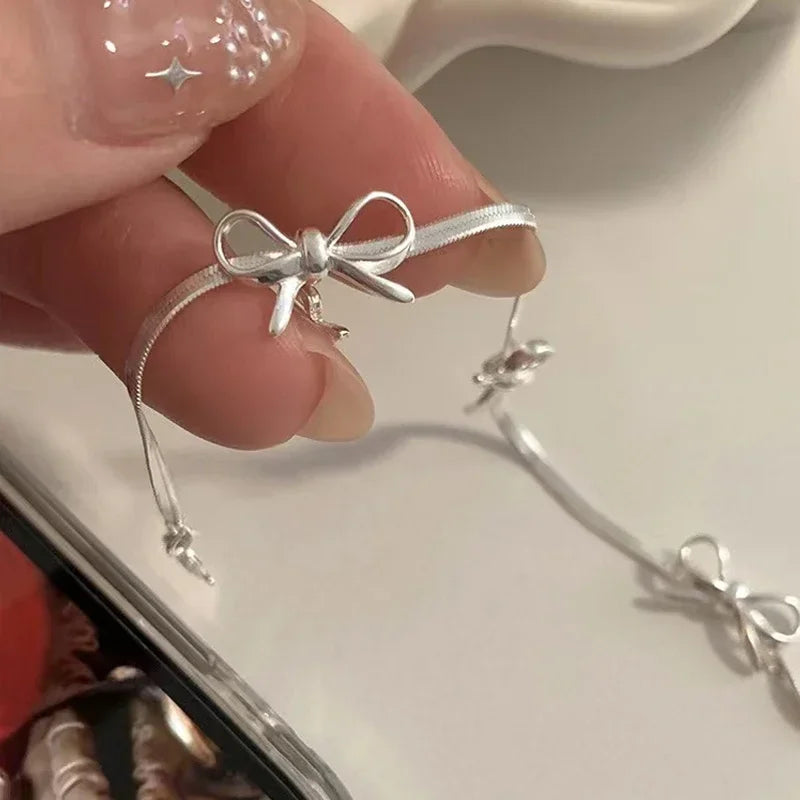 Pulsera con lazo de pajarita para mujer plata