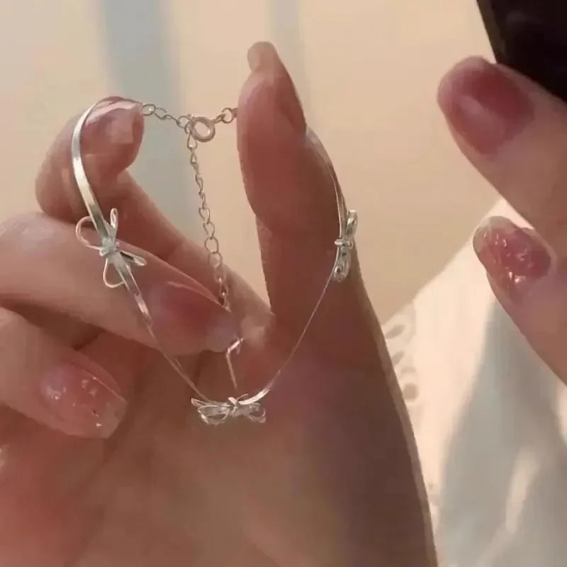 Pulsera con lazo de pajarita para mujer plata
