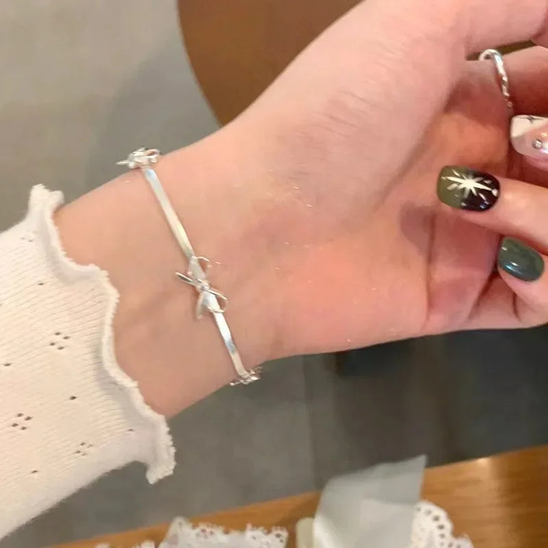 Pulsera con lazo de pajarita para mujer plata