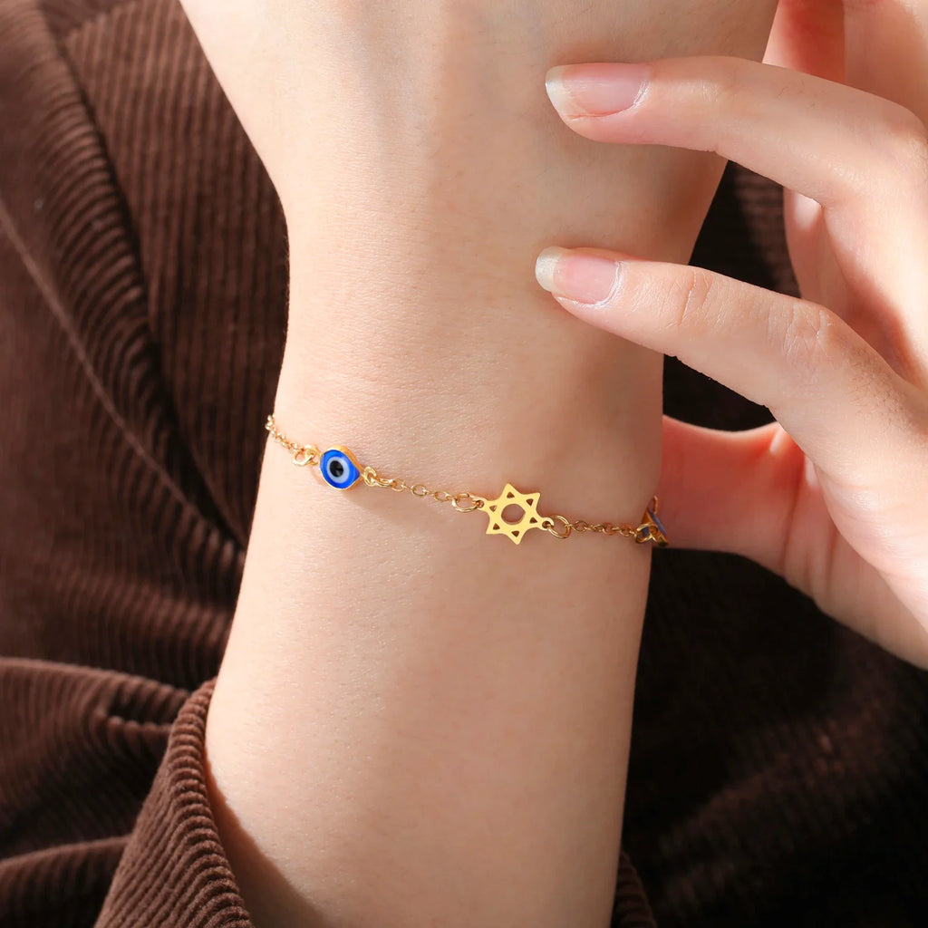 Pulsera con símbolos de protección ojo azul, Chai y la <span data-glossary-id="etoile-de-david">estrella de David</span> oro