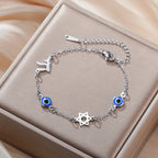 Pulsera con símbolos de protección ojo azul, Chai y la <span data-glossary-id="etoile-de-david">estrella de David</span> plata