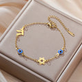 Pulsera con símbolos de protección ojo azul, Chai y la <span data-glossary-id="etoile-de-david">estrella de David</span> oro