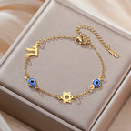 Pulsera con símbolos de protección ojo azul, Chai y la <span data-glossary-id="etoile-de-david">estrella de David</span> oro