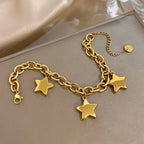 Pulsera con tres estrellas colgantes de oro