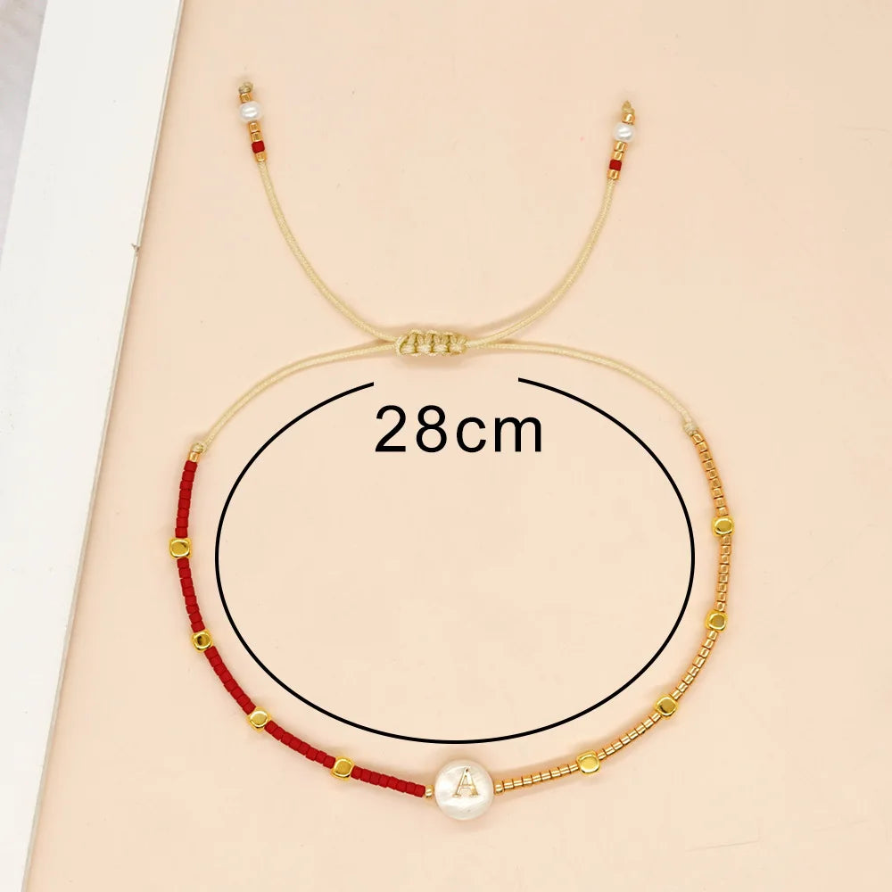 Pulsera bicolor inicial