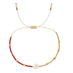 Pulsera bicolor inicial a