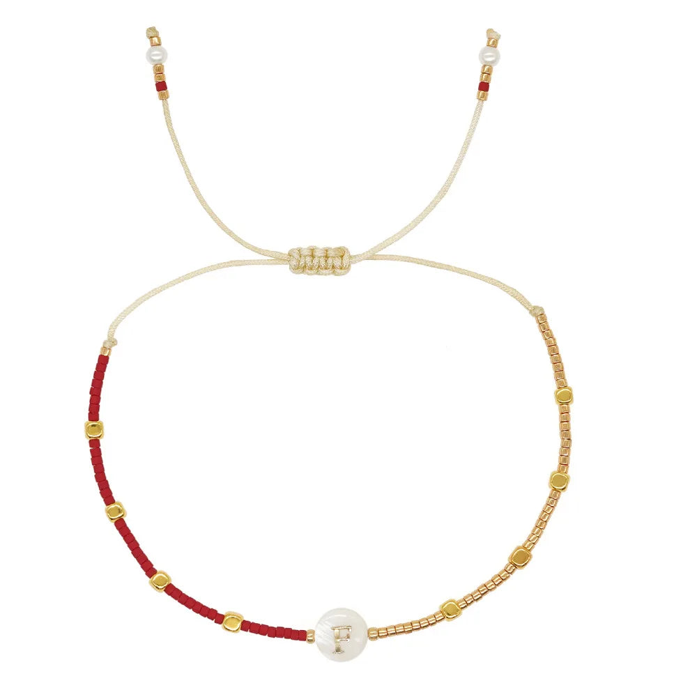 Pulsera bicolor inicial p