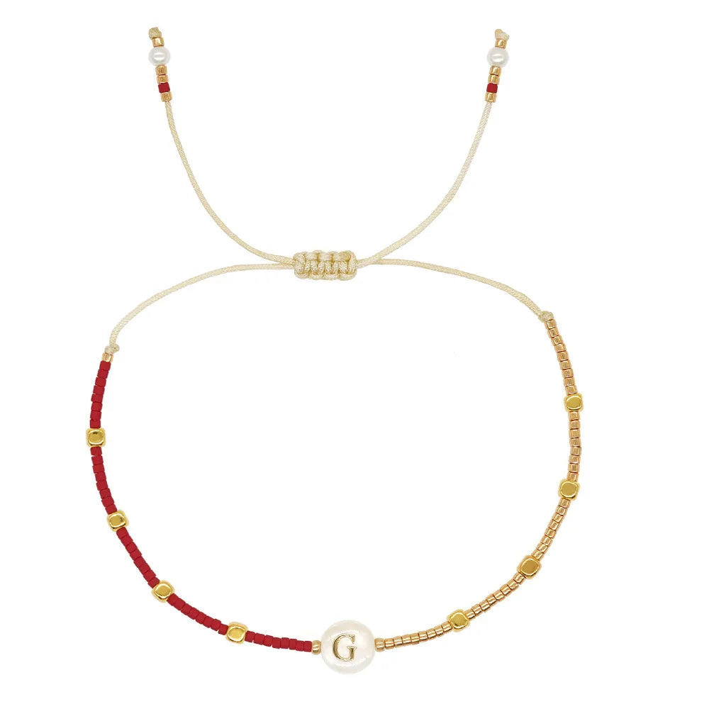 Pulsera bicolor inicial g