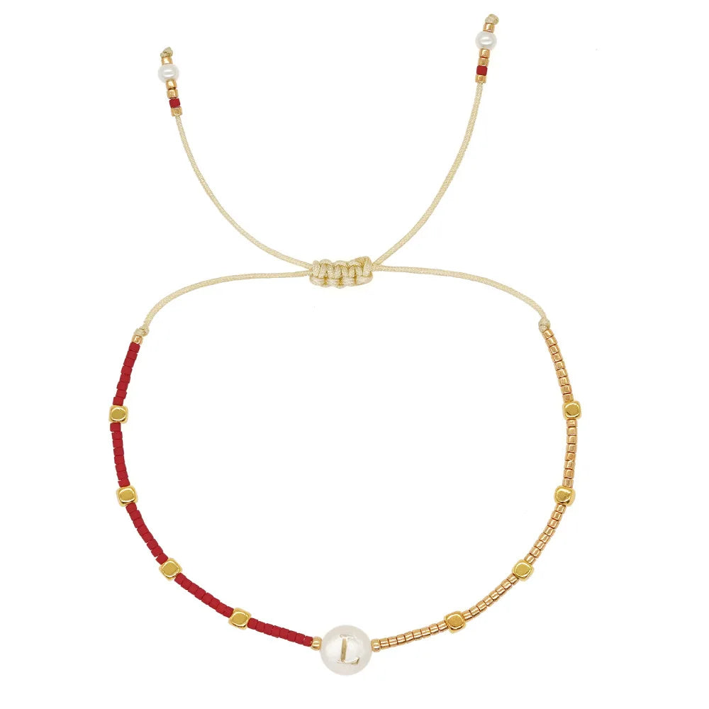 Pulsera bicolor inicial l
