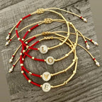 Pulsera bicolor inicial o