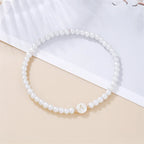 Pulsera blanca inicial a