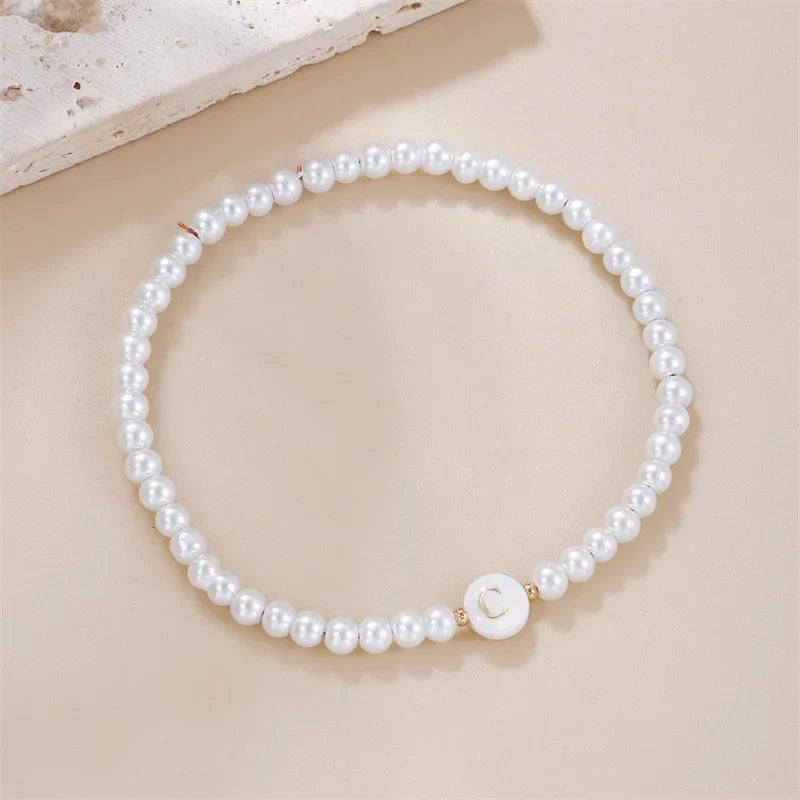 Pulsera blanca inicial c