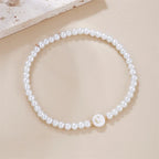 Pulsera blanca inicial c