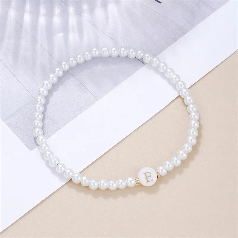 Pulsera blanca inicial e
