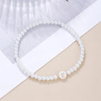 Pulsera blanca inicial e