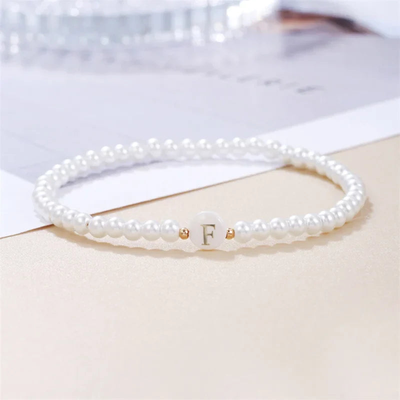 Pulsera blanca inicial f