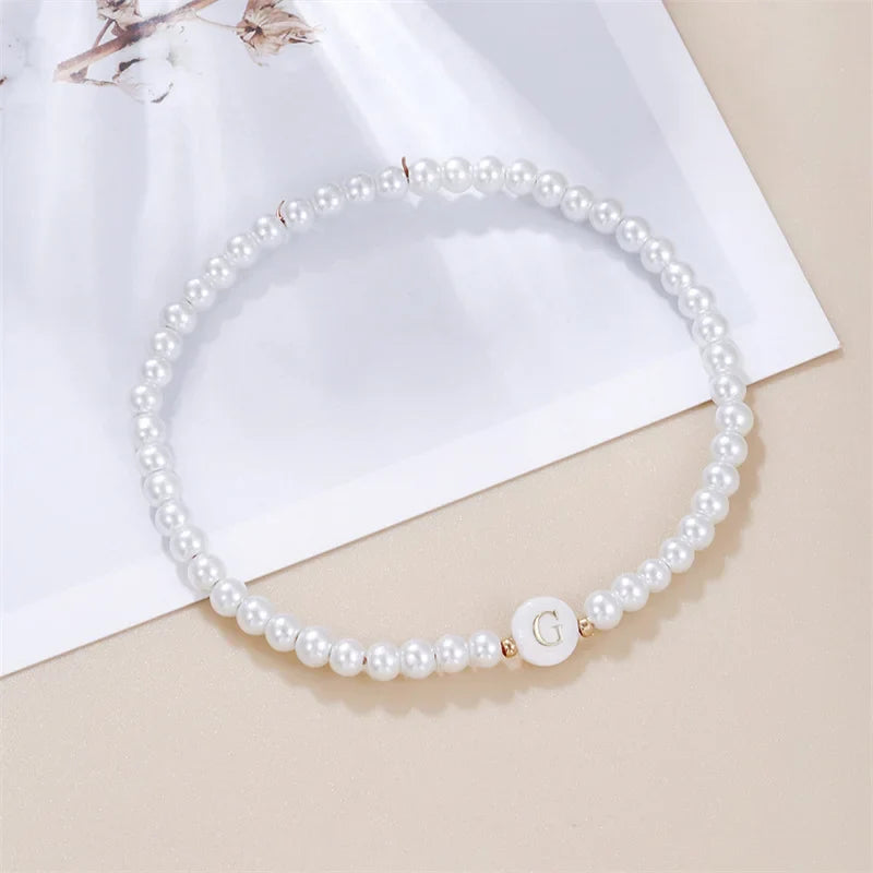 Pulsera blanca inicial g