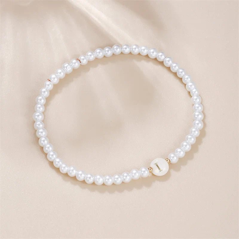 Pulsera blanca inicial i