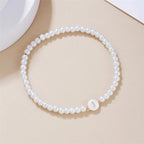 Pulsera blanca inicial j