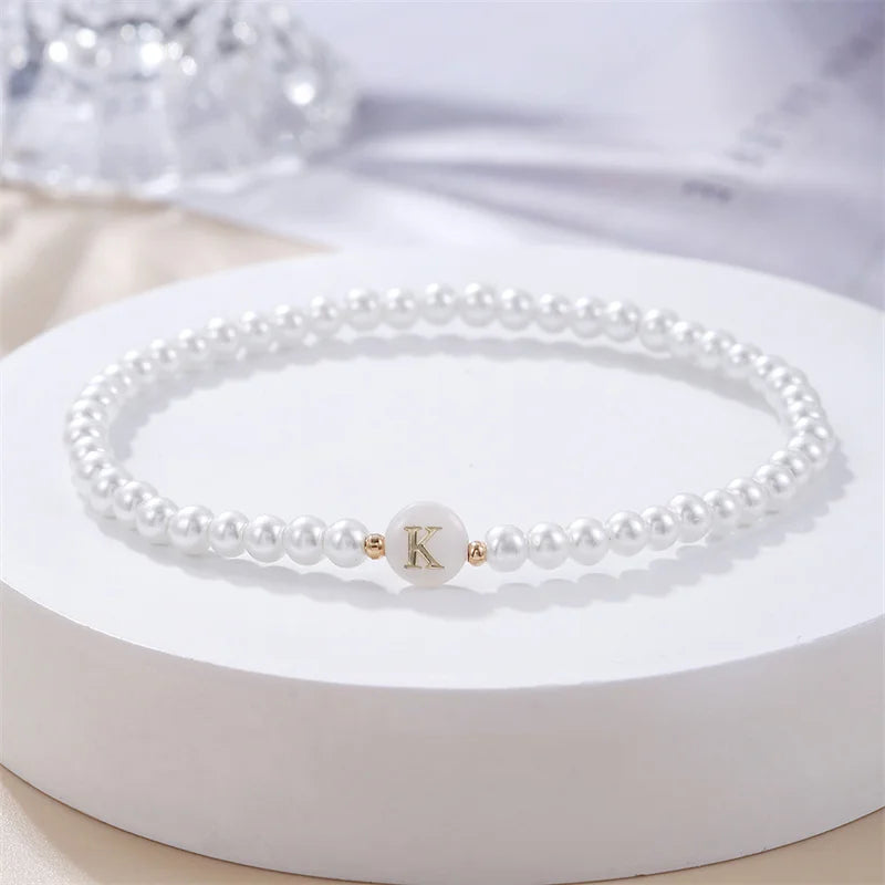 Pulsera blanca inicial k