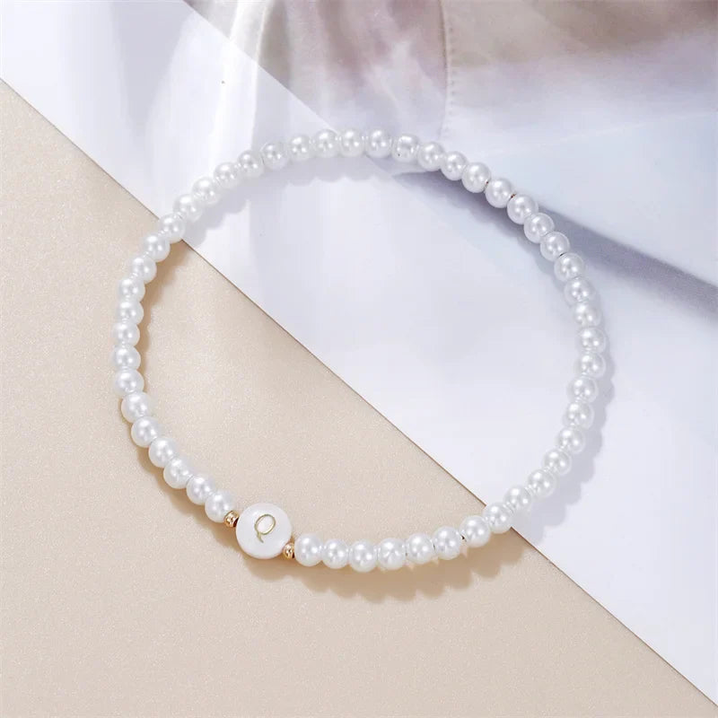 Pulsera blanca inicial q