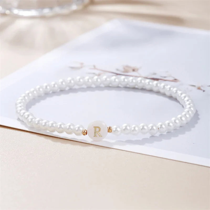 Pulsera blanca inicial r