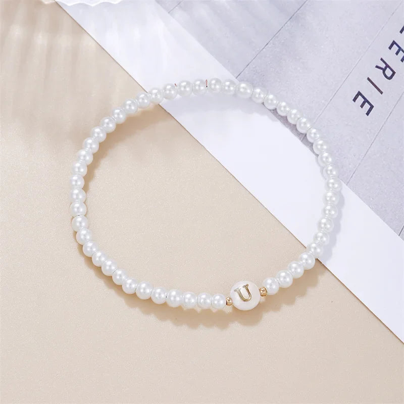 Pulsera blanca inicial u