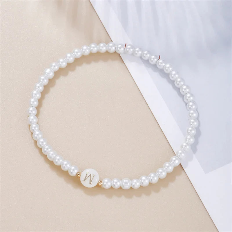 Pulsera blanca inicial w