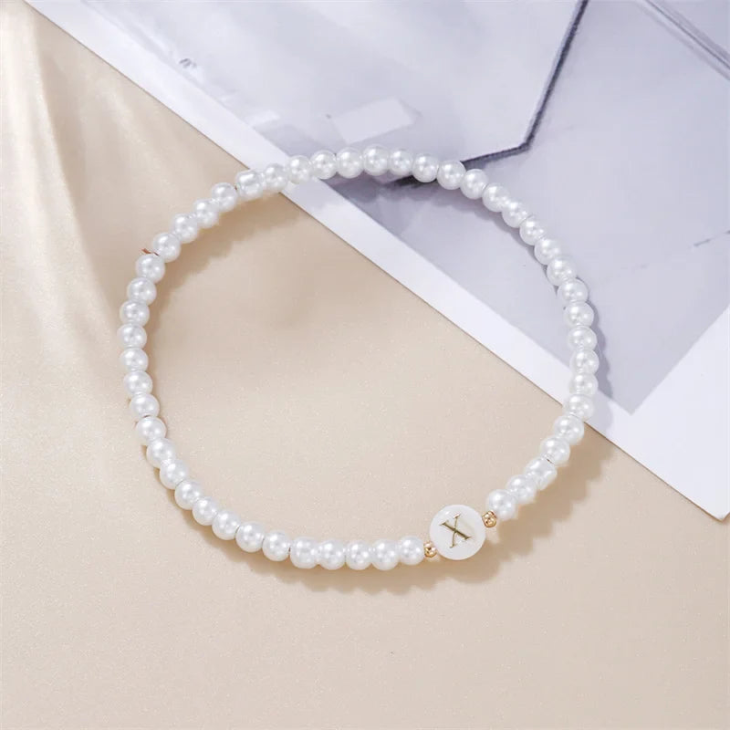 Pulsera blanca inicial x