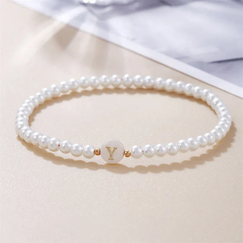 Pulsera blanca inicial y