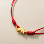 Pulsera budista con elefante rojo
